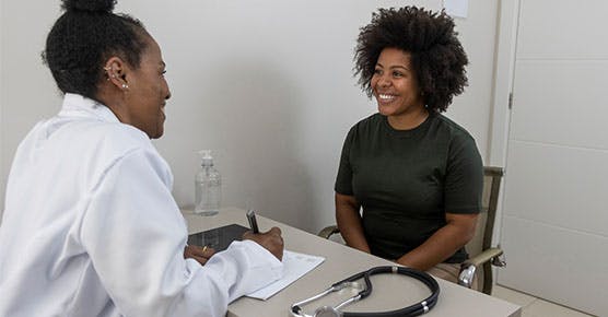 Image of patient talking to her internal medicine provider