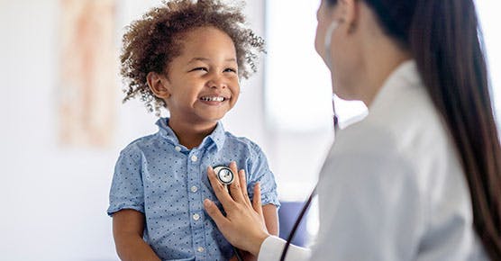 Image of pediatrician working with a young patient