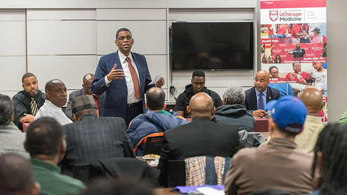 Public health expert Terry Mason, MD, speaks at a Community Grand Rounds event
