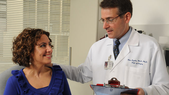 Peter Angelos, MD, with female patient