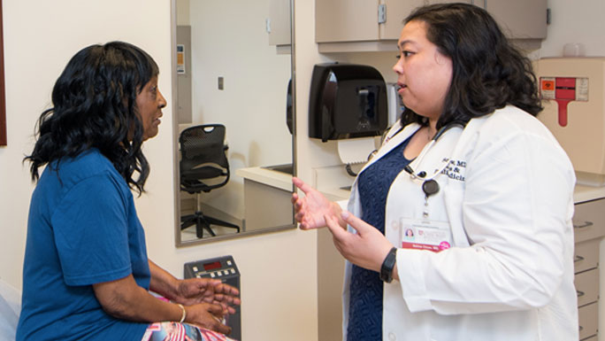 Selina Chow, MD, in geriatric oncology clinic with patient