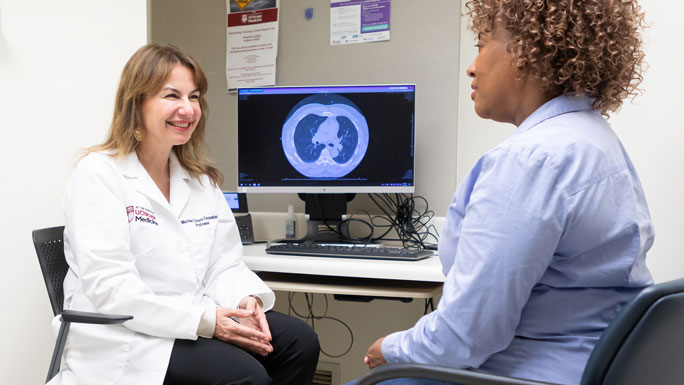 Marina Chiara Garassino, MD, and patient in clinic