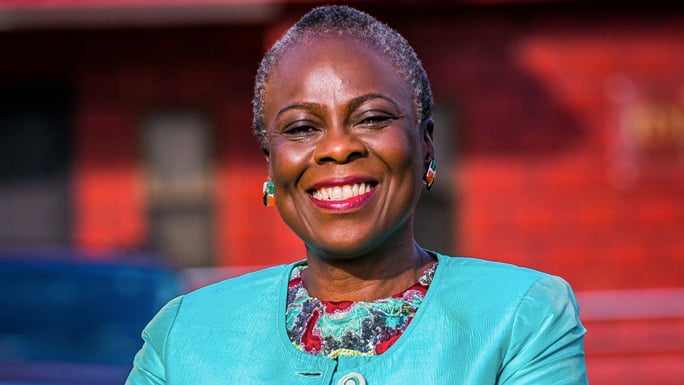 Olufunmilayo Olopade, MD, colorful headshot taken outside