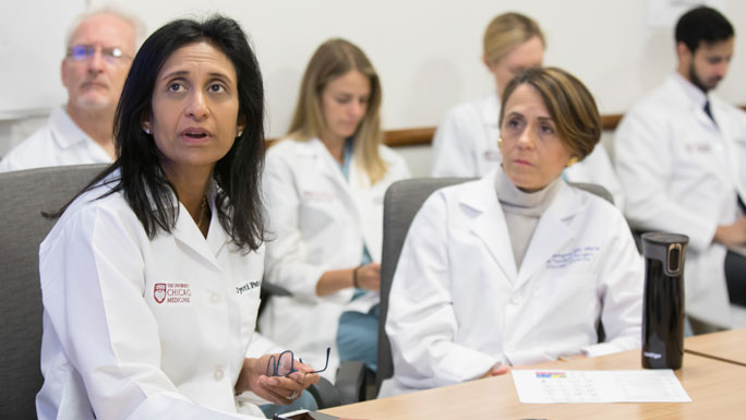 Jyoti Patel, MD, and Jessica Donington, MD, in a thoracic oncology tumor board meeting