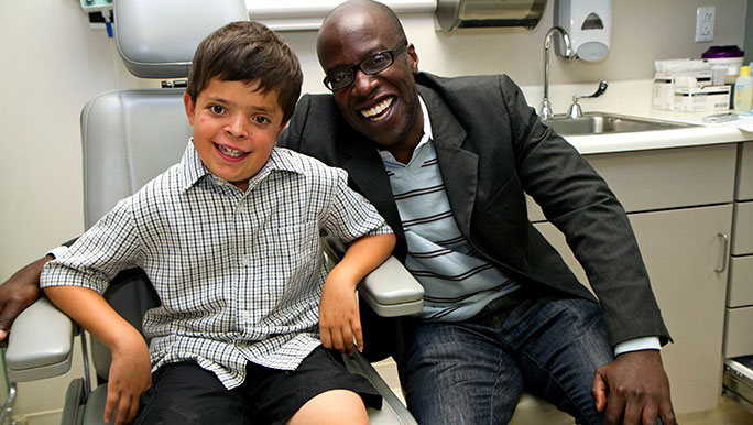 Pediatrics patient Ty Arroyo with surgeon Russell Reid, MD, PhD, from pediatric plastic and reconstructive surgery, and part of the Craniofacial Anomalies Multidisciplinary Program (CAMP).