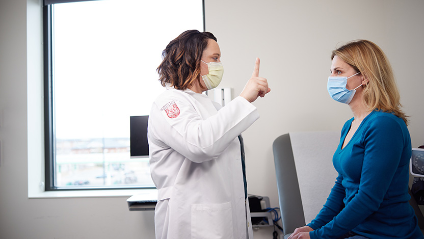 Dr. Cipriani evaluating a female patient