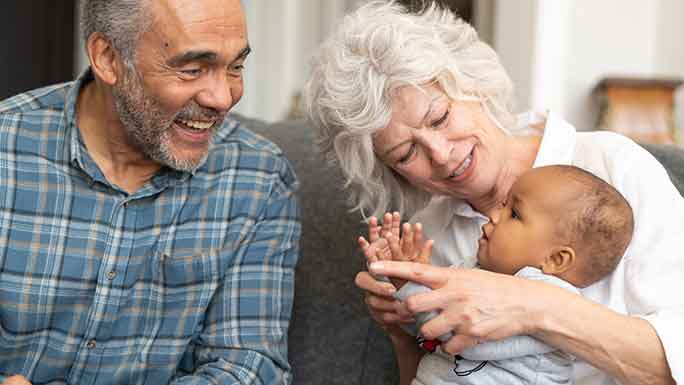 Grandparents play with baby