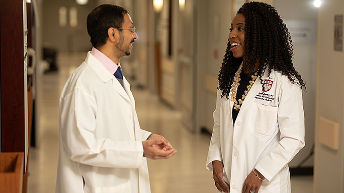Reproductive endocrinologists A. Musa Zamah, MD, PhD, and Amanda Adeleye, MD, having a conversation