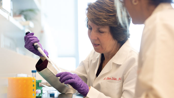 Eileen Dolan, PhD, with pipette