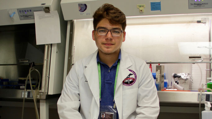 high school student working in cancer lab