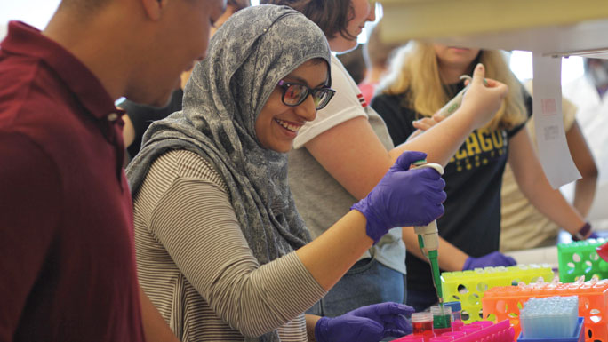 Asian girl using pipette