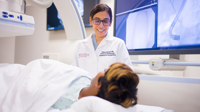 Uzma Siddiqui, MD, in CERT lab with patient