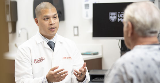 Oliver Eng, MD, meets with a patient in clinic