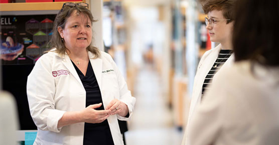 Kay McLeod, PhD, with graduate students