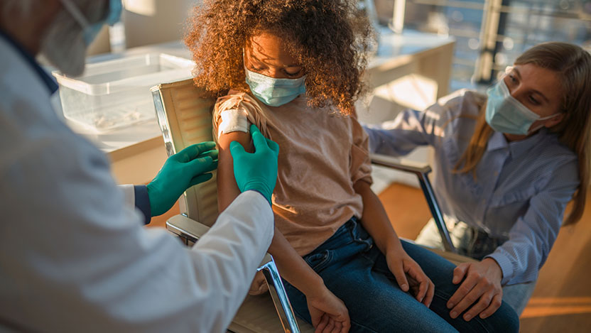 Image of family getting travel immunizations from pediatric infectious diseases expert