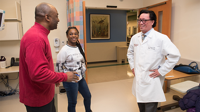 Mikaela J.L. Ewing and dad Michael talk with Dr. Steve Handoyo, December 5, 2017 at Comer
