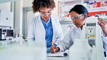 Two researchers working in a lab