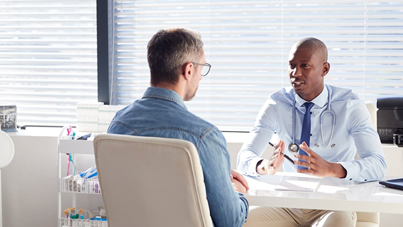 A gastroenterologist taking with a patient