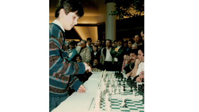 Lev Becker playing chess as a child