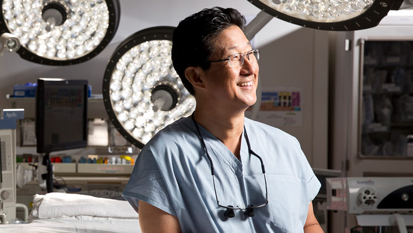 David Chang, MD, lymphedema surgery expert, portrait in surgical suite