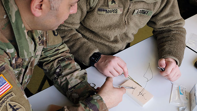 Members of the 909th Forward Resuscitative and Surgical Detachment (FRSD) practice trauma skills and medical scenarios in the University of Chicago Medicine simulation center as part of the health system's partnership with the U.S. Army. (Photos courtesy of 909th FRSD.)