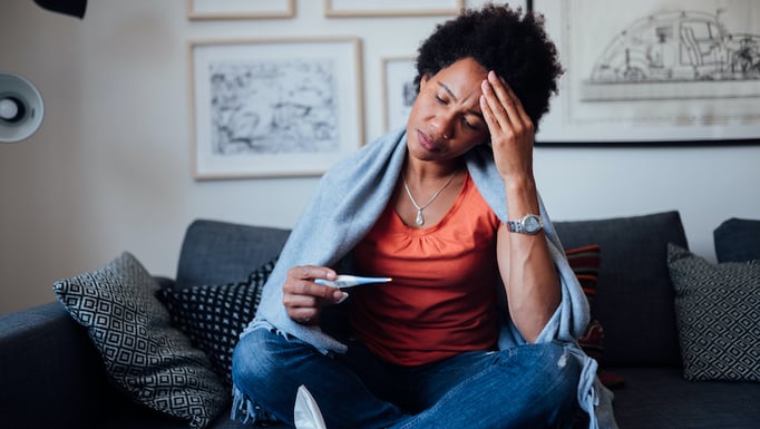 Person taking temperature