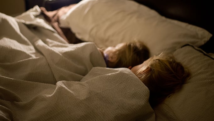 Kids sleeping in bed