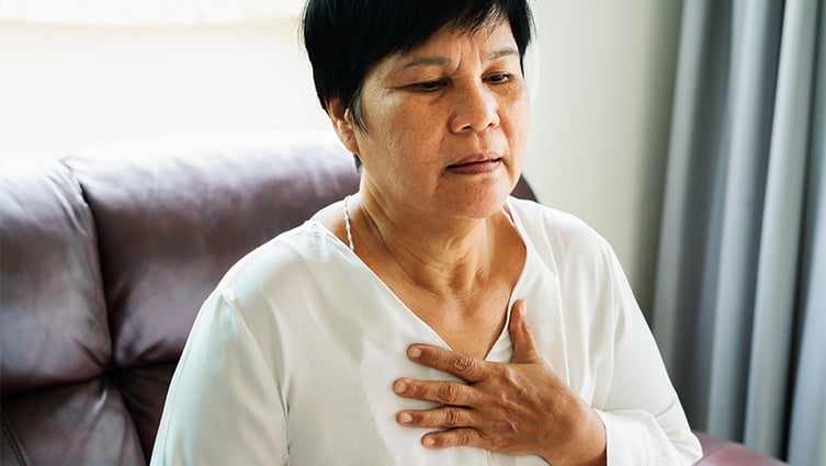 Woman grabs her chest