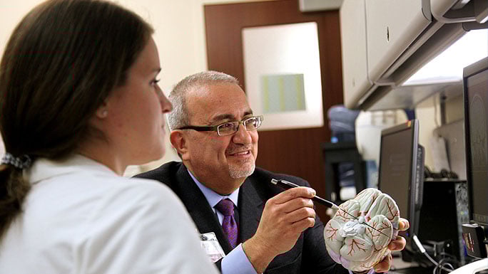 Neurosurgeon and HHT specialist Issam Awad, MD, and program coordinator Shannon Love