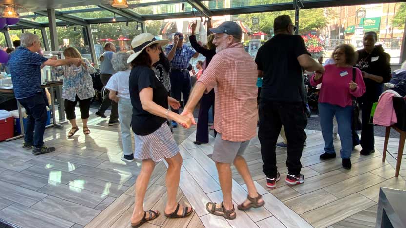Guests dancing on the UChicago Medicine's Memory Center Chicago River cruise