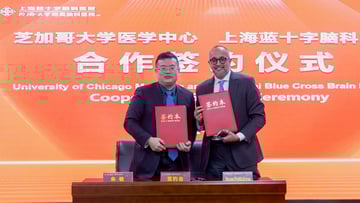 Zhu Min, general manager of Shanghai Blue Cross Brain Hospital (left), with Shyam Prabhakaran, MD, MS, Chair of Neurology at UChicago Medicine