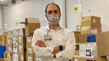 Eric Tritch standing in the warehouse