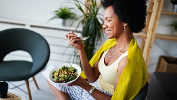 person eating salad