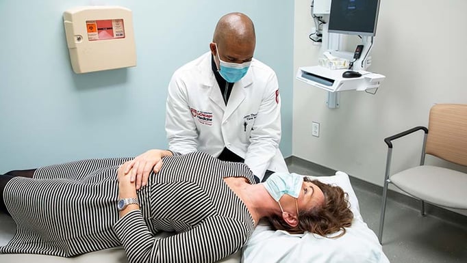 John R. Thurman, Jr., DO, with a patient