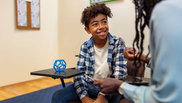 Image of pediatric patient talking to doctor during ADHD screening