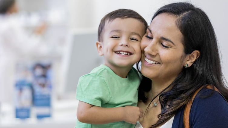 Mom holding toddler boy