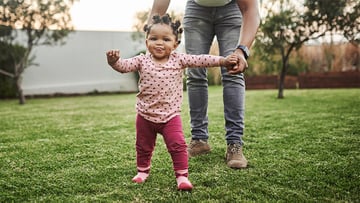 Young toddler learning to walk