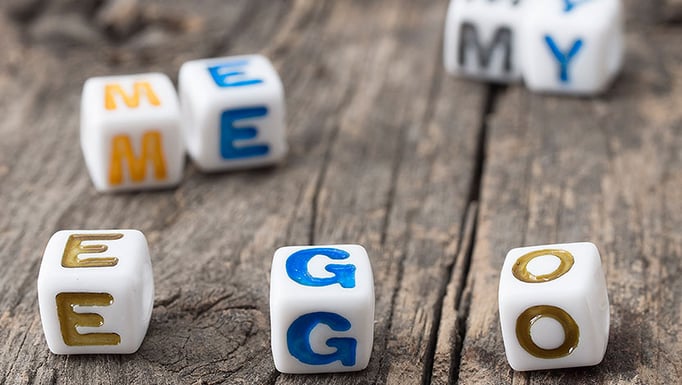 The words "ego", "me" and "my" spelled in dice
