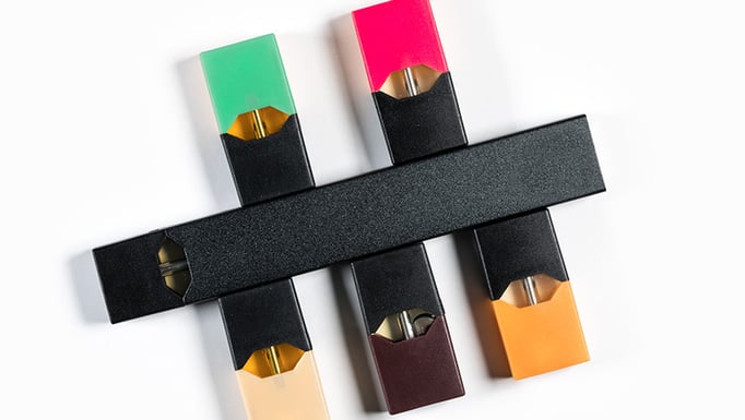 An electronic cigarette with flavor dispensers