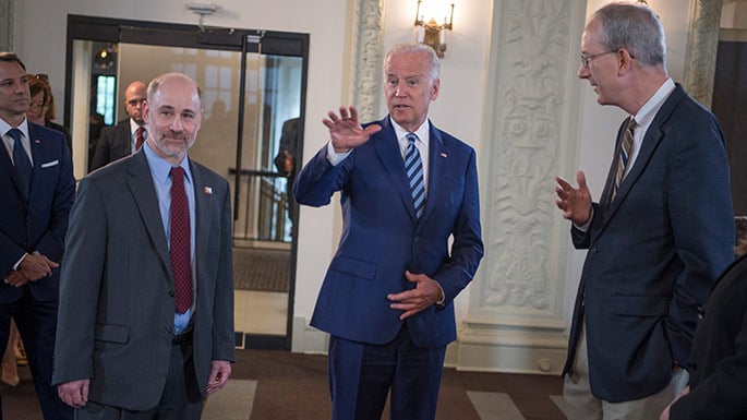 Vice President Joe Biden talks with Prof. Robert Grossman, PhD, (left) Department of Medicine and the College and Senior Fellow with the Computation Institute, and Louis M. Staudt, MD, PhD, (right) with the NCI, as they launch the NCI Genomic Data Commons (GDC), a system designed and developed by the Center for Data Intensive Science at the University of Chicago and presented Monday, June 6, 2016, at their office in the Shoreland in Chicago.