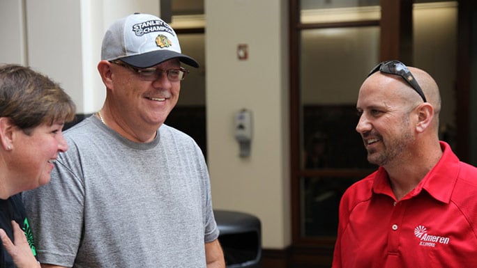 Kidney transplant patient Stewart Botsford (grey shirt, hat) meets his donor, Justin Maduena (red shirt) for the first time on August 11, 2016.
