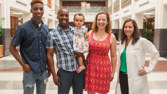 Kate McClinton and her family meet with Iris Romero, MD, an obstetrician at the University of Chicago Medicine Family Birth Center, after the May 2015 birth of Kate
