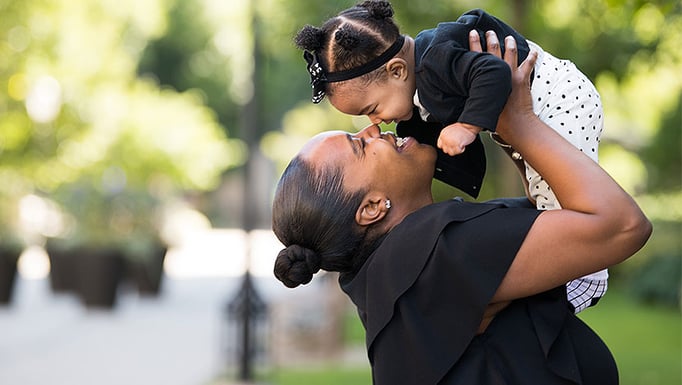 Katrina Calhoun holds up infant daughter, Addalyn, born safely with a plan to manage complications caused by placenta accreta