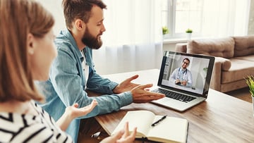 Couple on video visit with doctor
