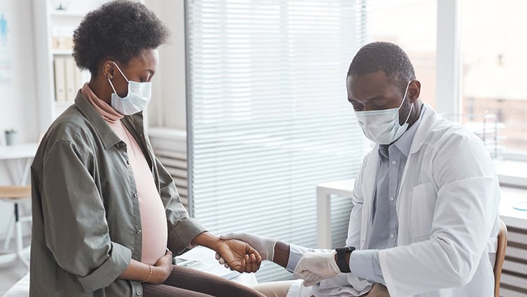 Doctor checking pregnant woman