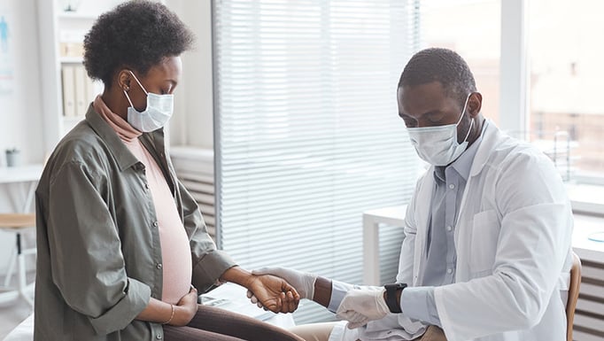 Doctor checking pregnant woman