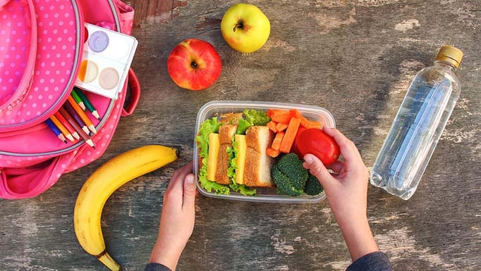 A school lunch filled with fruits and vegetables