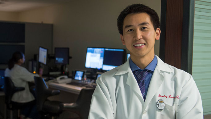 Stanley Liauw, MD, radiation oncologist, standing in front of a radiation therapy planning room