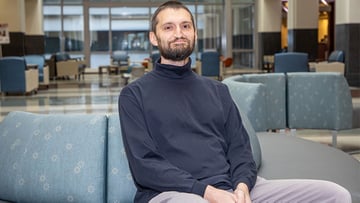 Dmitry Karpeyev, PhD, survived a dangerous cancerous tumor behind his face; now he