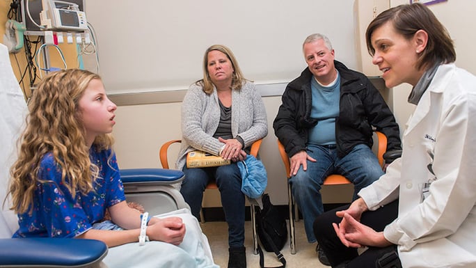 Dr. Hilary Jericho with patient and family